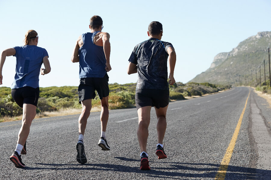 Breitling triathlon squad members Daniela Ryf, Jan Frodeno and Chris McCormack running - left to right