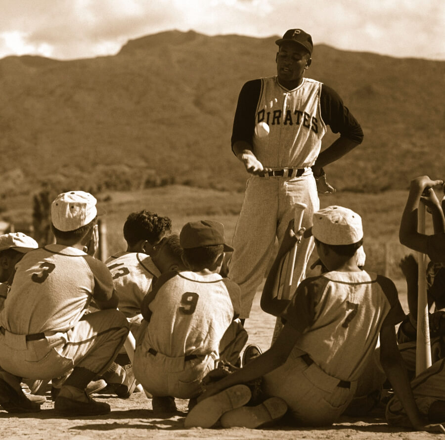 Roberto Clemente conducting a baseball clinic for local children in his native Puerto Rico