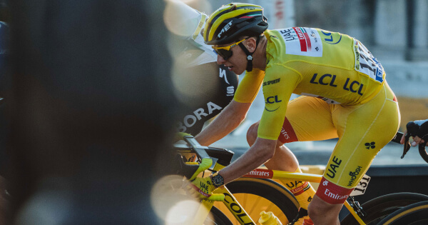 Tadej Pogačar Wears Yellow Jersey And A Yellow Breitling Endurance Pro On Top Of The Podium In Paris